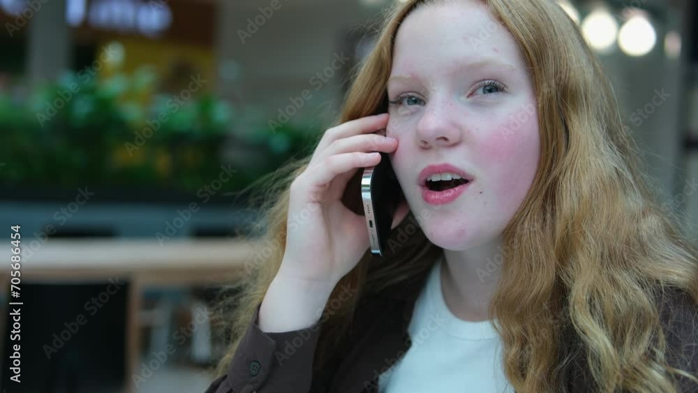 A young girl talking on the phone. Close-up of her face. A young girl talking on the phone. Close-up of her face.