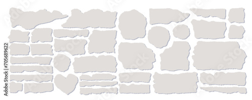 Set of torn gray paper isolated on a white background. Vector illustration of small scraps of torn paper of different sizes and shapes. Crumbled pieces of pages. photo