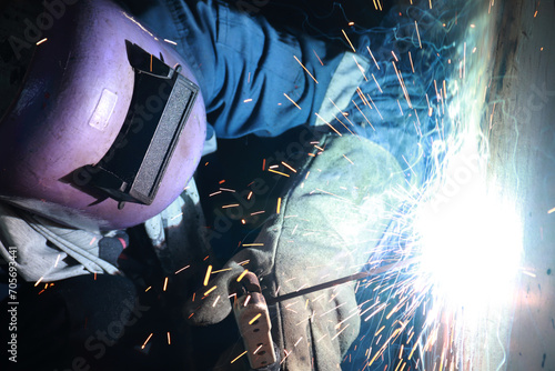 Steel welder builds technical, industrial steel welder in technical factory