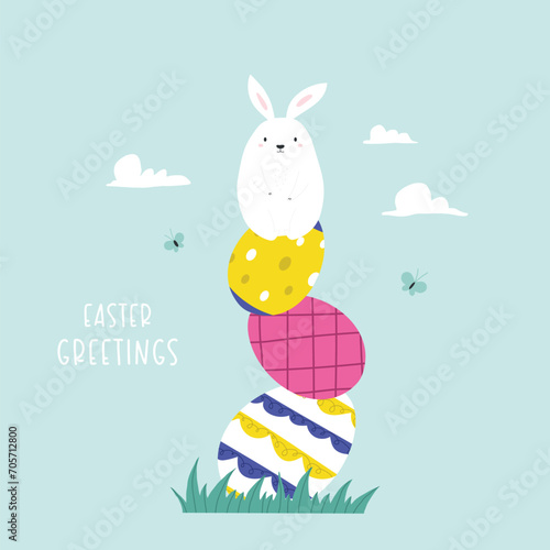 Easter greeting card with funny rabbit, bunny sitting on a pile of eggs
