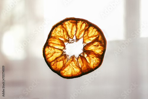 Fototapeta Naklejka Na Ścianę i Meble -  Dried orange slices. Dry citrus. Tangerine or mandarin fruits