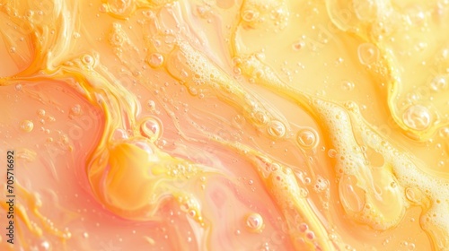 Abstract background in peach and yellow colors with liquid paint texture