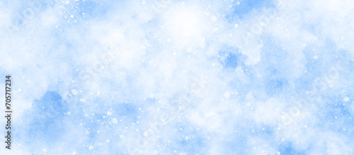Blue watercolor painting on winter seasonal morning texture, sunshine or sparkling lights and glittering glow winter morning of snow falling background, abstract bokeh glitter background on blue. 