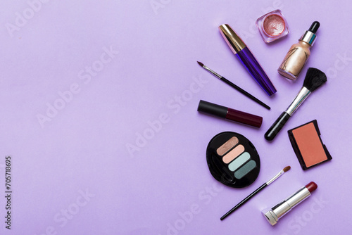 Fototapeta Naklejka Na Ścianę i Meble -  Professional makeup tools. Top view. Flat lay. Beauty, decorative cosmetics. Makeup brushes set and color eyeshadow palette on table background. Minimalistic style