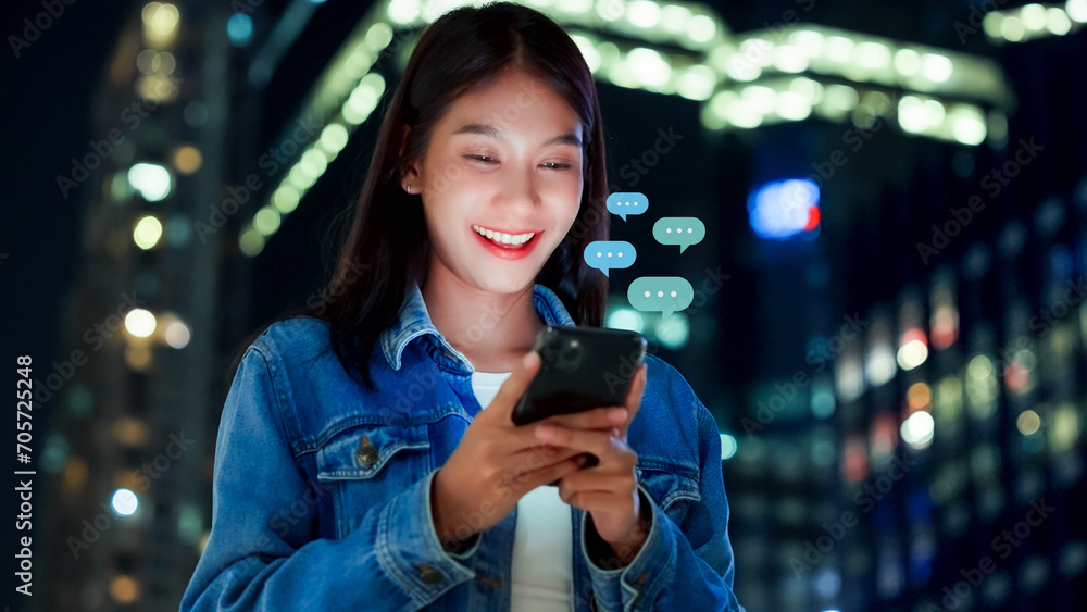 Hand of woman typing text on mobile smartphone in city night life. Online live chat chatting on application communication digital media website and social network