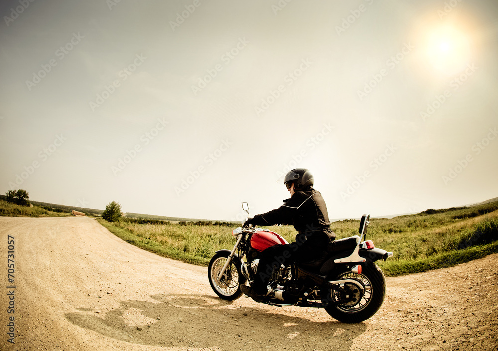 Biker on the road against the sky