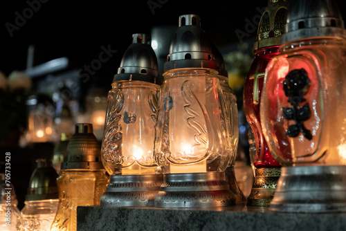 Canvas Print Cemetery grave candle glass lanterns, znicz illuminated at night