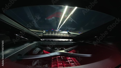 Hyper lapse of engine supercar luxury Lamborghini Huracan car driving on the street at night