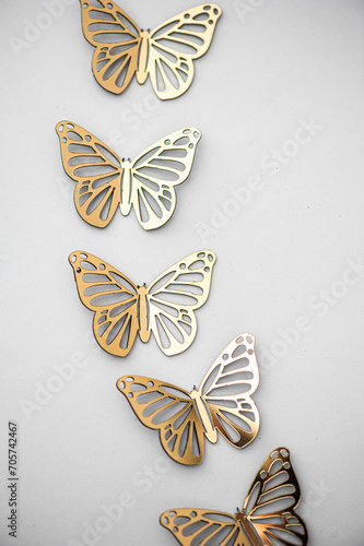beautiful gold butterflies on white background