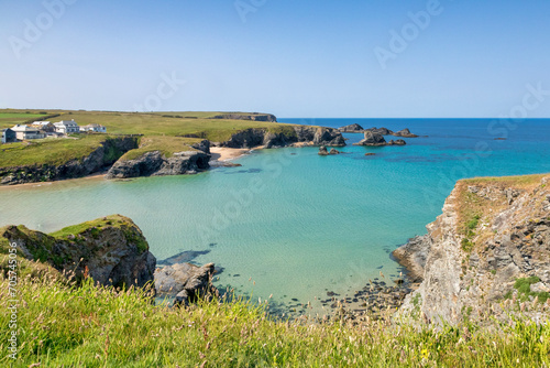 Trescore Islands near Porthcothan, Cornwall, UK,which can accessed via the beach at low tide. Cliff top homes can be seen. photo