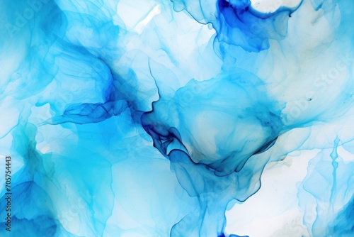  a close up view of blue ink swirling in a watercolor like pattern on a white sheet of paper with a black ink pen in the middle of the bottom corner of the image.