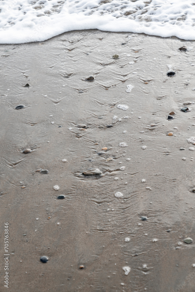 Beach with stones pebbles in dark sand Dominical Costa Rica Beach with stones pebbles in dark sand Dominical Costa Rica