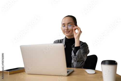 An employee programmer uses a laptop computer in the workplace. A business woman in business clothes looks at the screen.