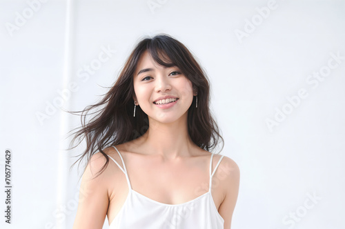 Portrait of Beautiful Asian Woman with her Smooth skin look at camera on White background in Studio light. generative AI.