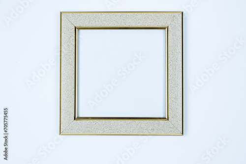 The frame is light, silver, the frame is white with gold edging on a white background.
