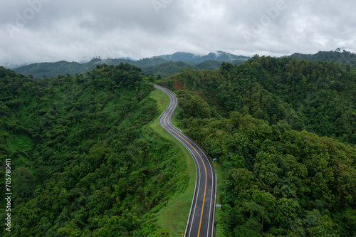 The road is similar to the number 3, This road is built on a mountain, past the forest in Nan Province of Thailand. © Panwasin