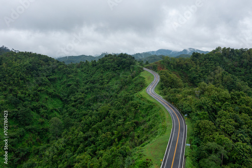 The road is similar to the number 3, This road is built on a mountain, past the forest in Nan Province of Thailand.