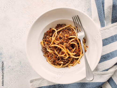 Spaghetti bolognese with minced meat or Makarony Po Flotski or Russian Navy Style Pasta. Top view. Navy spaghetti in plate, copy space. photo