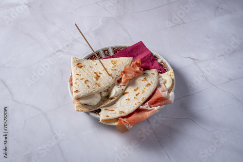 plate with piadina with raw ham and squacquerone photo