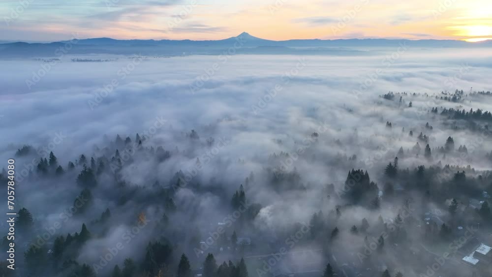 With Mt. Hood in the distance, dense fog covers the Willamette Valley in Oregon, not far south of Portland. This Pacific Northwest region is known for its beautiful forests and wet weather.