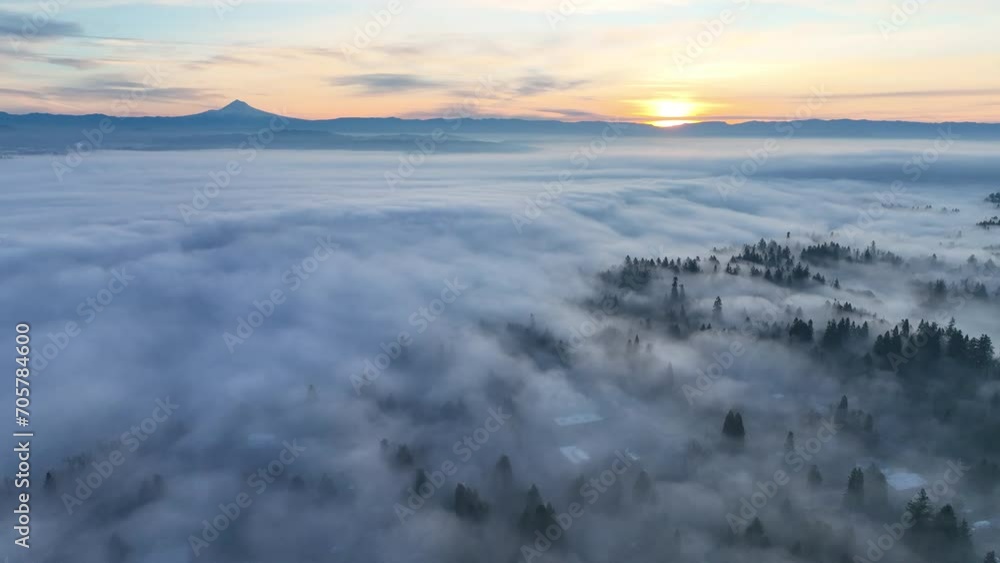 With Mt. Hood in the distance, dense fog covers the Willamette Valley in Oregon, not far south of Portland. This Pacific Northwest region is known for its beautiful forests and wet weather.