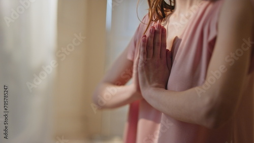 Obraz na plátně Closeup namaste hands doing yoga in morning