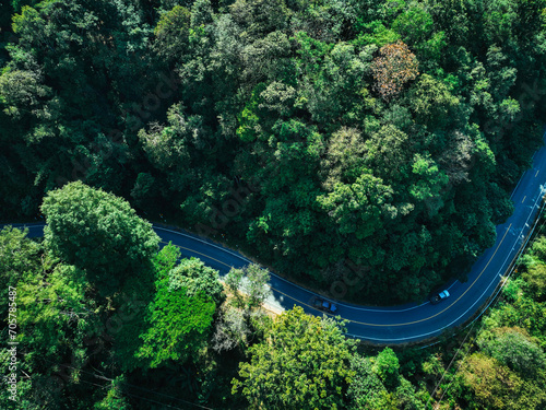 Road in the middle of the forest , road curve construction up to mountain, Rainforest ecosystem and healthy environment concept 