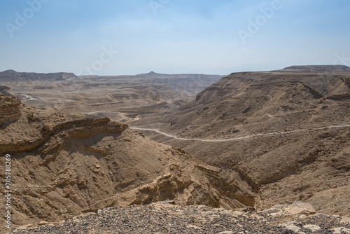 Antique road in Negev Desert in southern Israel during the summer. Desert landscape with volcanic rocks nature