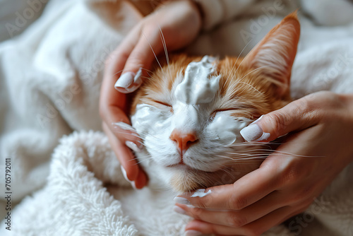 Close-Up giving her cat a facial during a spa treatment, in the style of multi layered texture, light red and white, organic material.