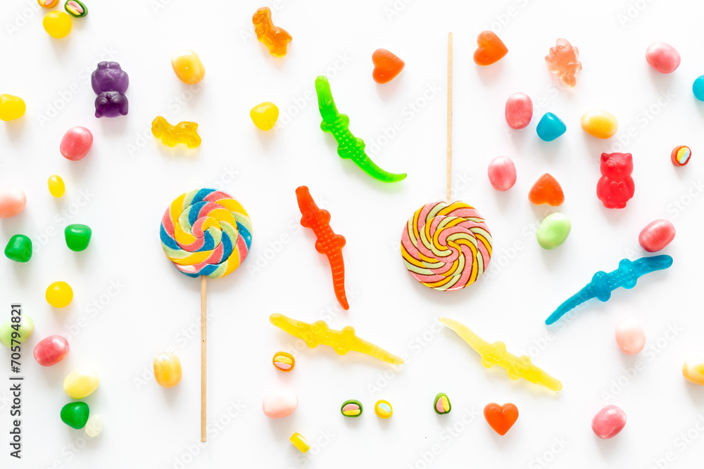 Food pattern with candies and lollipop. Sweet food and candies background Food pattern with candies and lollipop. Sweet food and candies background