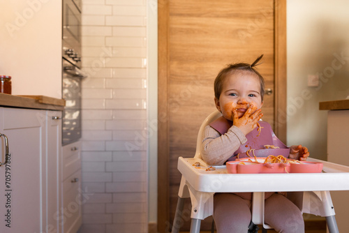 baby girl practice eat food by her self, Baby-Led Weaning concept