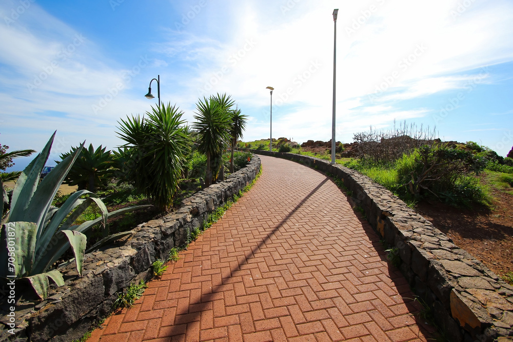 Paved walkway leading to the Cape of Garajau in Caniço near Funchal on Madeira Island (Portugal) in the Atlantic Ocean