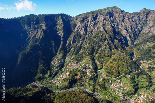 View of the village of Curral das Freiras (Corral of the Nuns) from the Eira do Serrado viewpoint in the mountainous setting of the Valley of the Nuns on Madeira island, Portugal photo