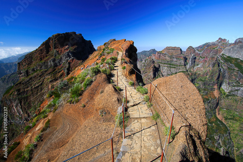Walking trail at the Pico do Arieiro mountain peak on Madeira island, Portugal - Paved footpath for hikers visiting the third highest mountain of the island photo