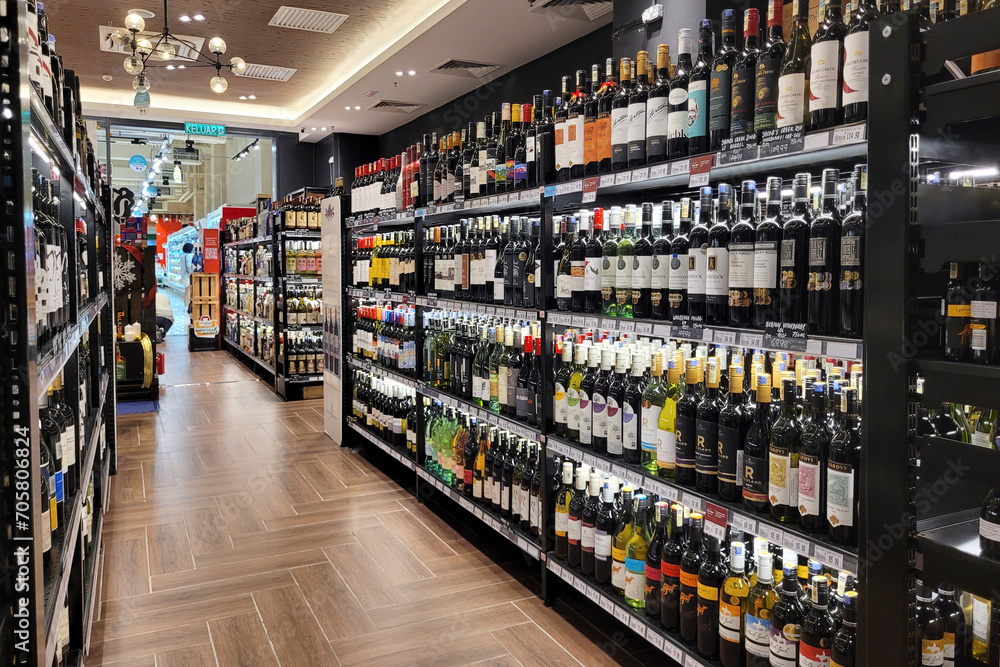 PENANG, MALAYSIA 1 DEC 2023 Wine bottles and liquor are showcased on