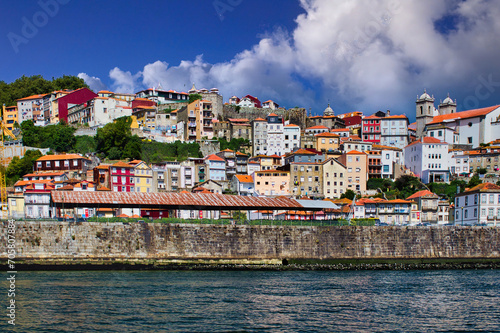 Fototapeta Naklejka Na Ścianę i Meble -  Overview of the Cais da Ribeira, the port district, with its colorful houses and cobbled streets, is one of the most characteristic places in Porto.