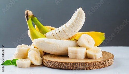 bunch of banana fruits peeled cut bananas on white background photo
