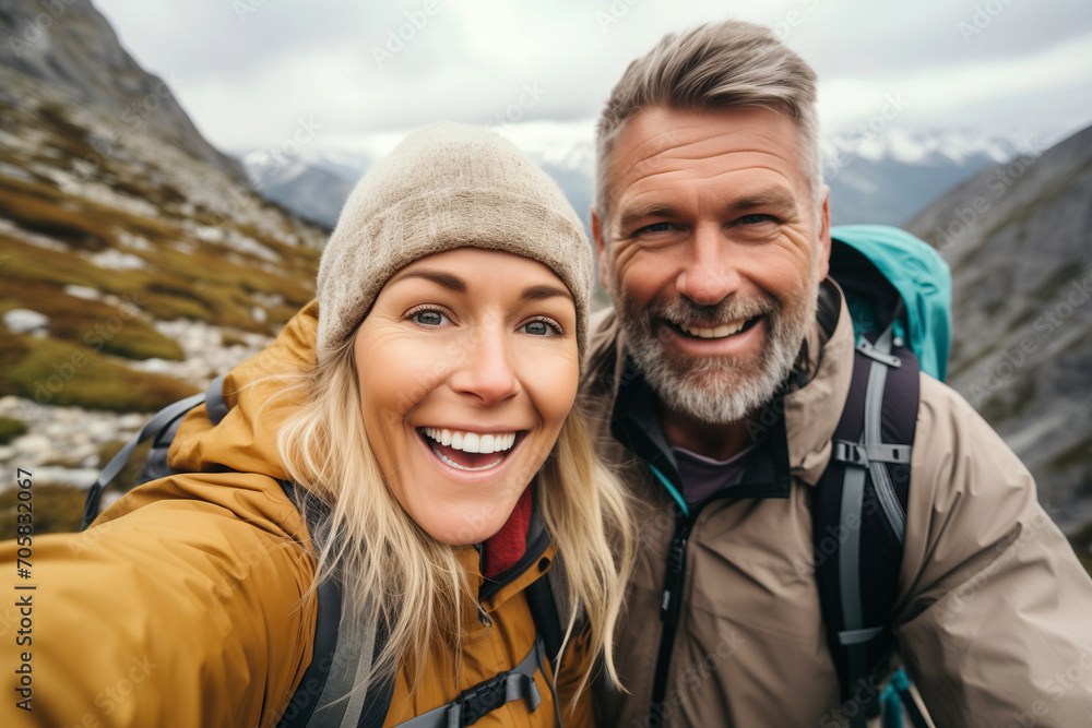 Couple taking a selfie while trekking in the mountain Couple taking a selfie while trekking in the mountain