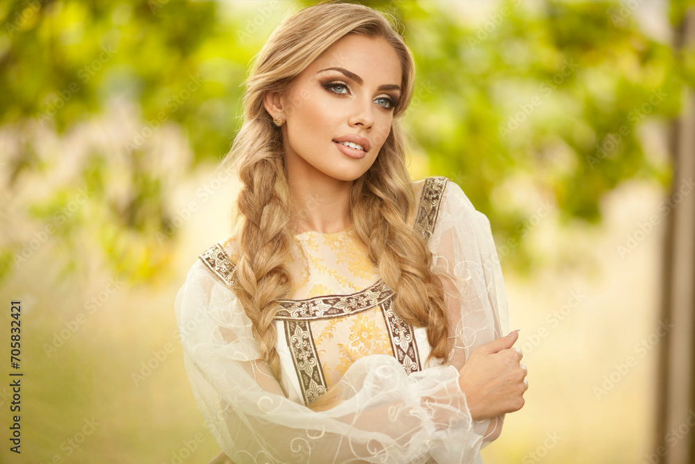 Beautiful young Russian girl with white hair in the national Russian style.hairstyle two braids Beautiful young Russian girl with white hair in the national Russian style.hairstyle two braids