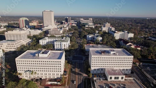 Drone shot and aerial view of downtown state capitol, government buildings, college town, tall buildings, and highrises in the city of Tallahassee, Fl in Florida, United States photo