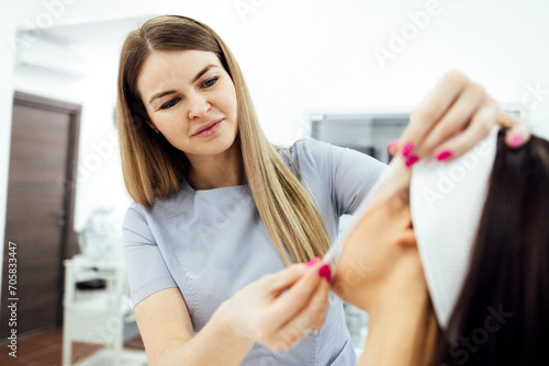 Thread lift, cropped cosmetologist preparing to do procedure
