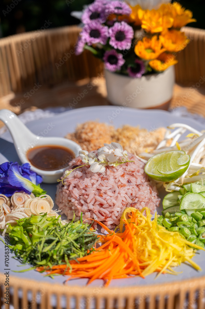 Steamed rice with various herbs and vegetables mixed with Budu sauce. Thai Southern Spicy Rice Salad with Vegetables with Budu Thai southern styled fish sauce. Steamed rice with various herbs and vegetables mixed with Budu sauce. Thai Southern Spicy Rice Salad with Vegetables with Budu Thai southern styled fish sauce.