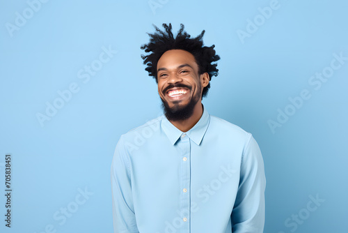 Colorful studio portrait of an ethnic man smiling happily. Pale blue dominant color. Generative AI