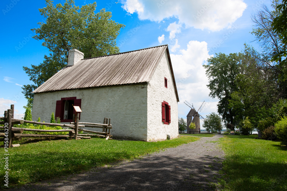 Obraz premium Rural house with windmill