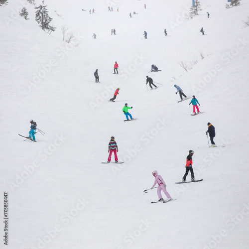 Skiers and snowboarders ski in the Carpathians.