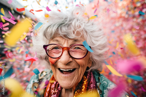 Confetti Elegance: A Close-Up Portrait of a Mature Woman Cherishing Festive Moments