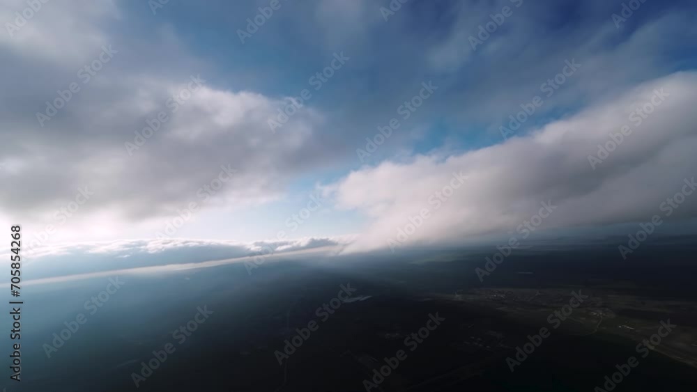 4K.Aero video shooting. Fly above the clouds and the sun in the sky, in a mountainous area. Amazing flyover through clouds with beautiful light on a fixed wing FPV drone 4K.Aero video shooting. Fly above the clouds and the sun in the sky, in a mountainous area. Amazing flyover through clouds with beautiful light on a fixed wing FPV drone