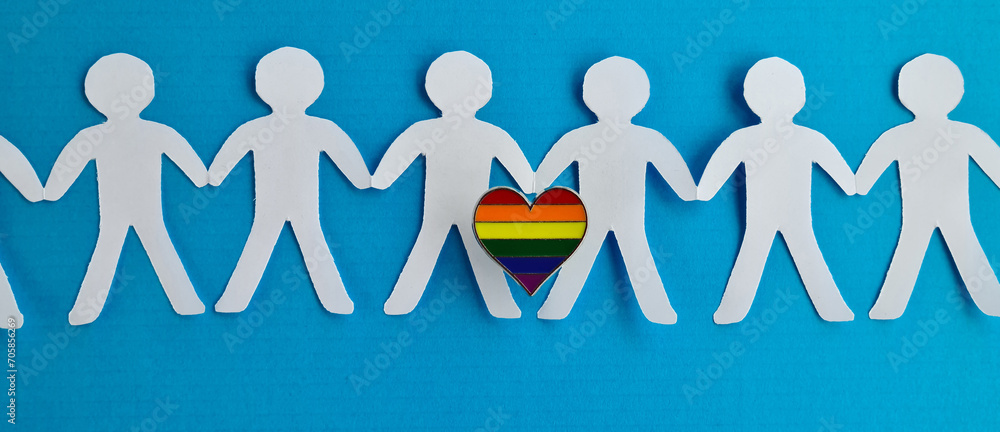 Group of figurines hold hands and lgbt sign Group of figurines hold hands and lgbt sign