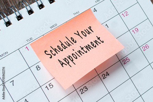 Schedule your appointment text on orange paper sticky note.