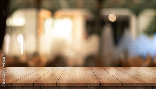 	
Empty wooden table top with lights bokeh on blur restaurant background.	
 photo